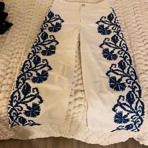White pants with gorgeous blue detail down the sides